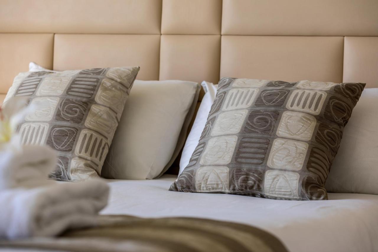 Constantinos The Great Beach Hotel Protaras Exterior photo Pillows on a bed